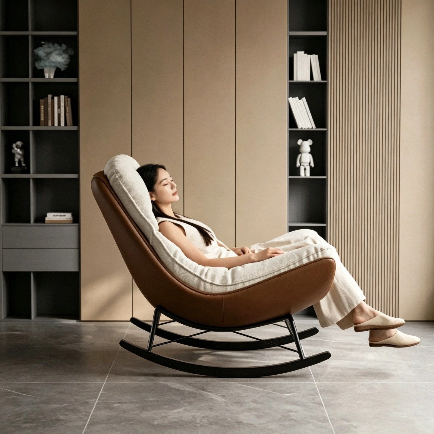 Edie rocking chair in beige chenille styled in a modern living room with a person seated and relaxing