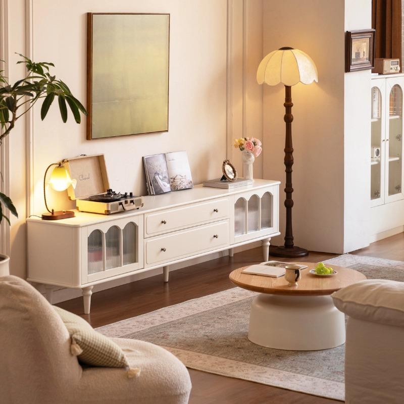 Emily TV console styled in a living room with decor and floor lamp alongside
