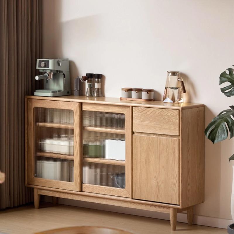 Gladys sideboard in natural oak, lifestyle shot showing the cabinet styled as a coffee station in a living room