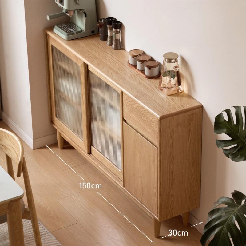 Gladys sideboard in natural oak, lifestyle shot showing the cabinet styled against a wall with decor