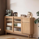Gladys sideboard in natural oak, lifestyle shot showing the cabinet styled as a coffee station in a living room